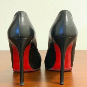 Christian Louboutin open toe pumps.